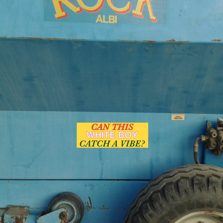 Blue vehicle with a yellow sticker reading &