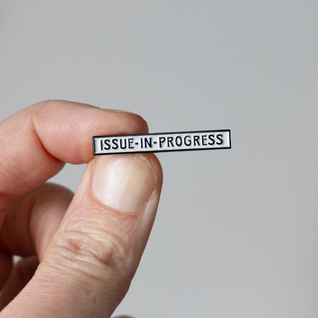 The French Dispatch inspired Enamel Pin! Held
