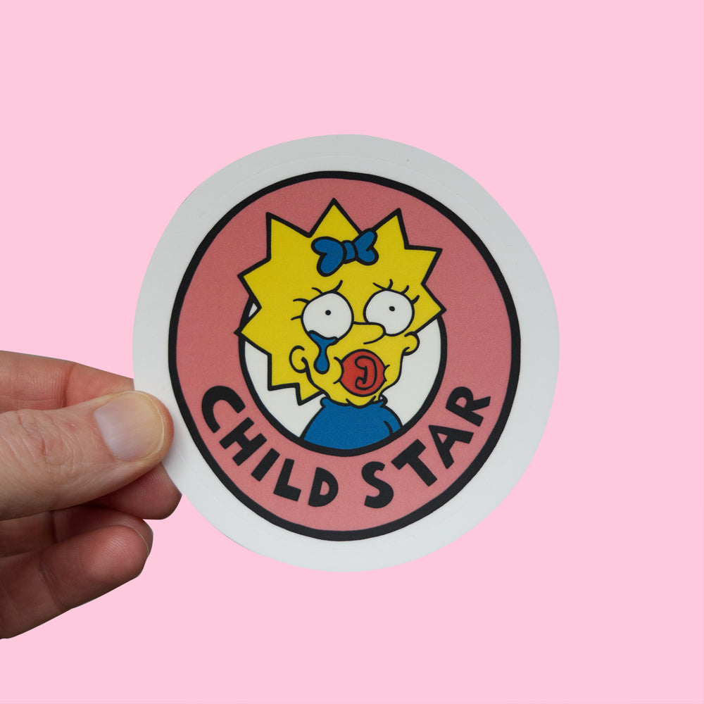 Maggie Simpson Child Star Sticker held