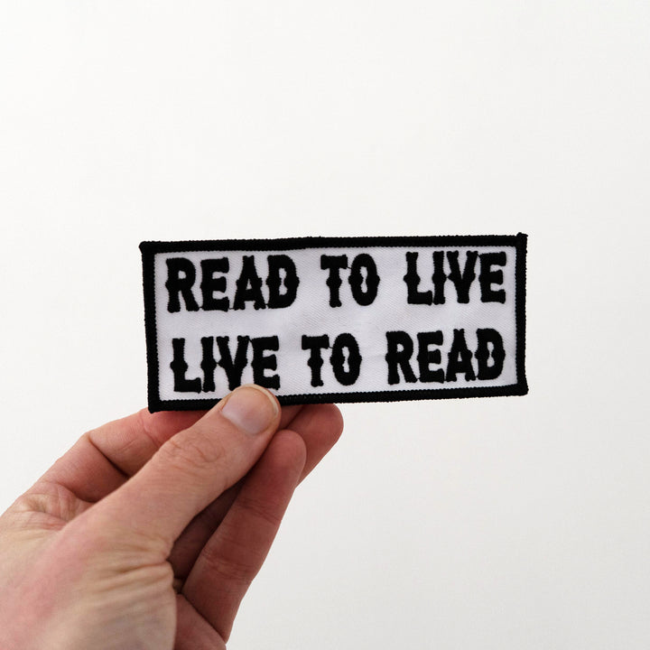Read to Live, Live to Read! Embroidered Patch held