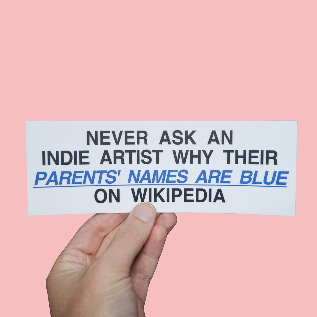 Never ask an Indie Artist why their parents names are Blue on Wikipedia Bumper Sticker! held in left hand
