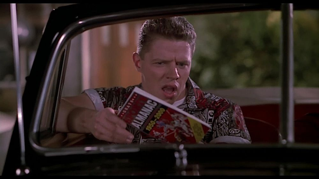 Biff holding Sports Almanac in the film