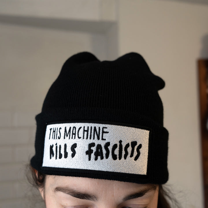 This Machine Kills Fascists Beanie warn